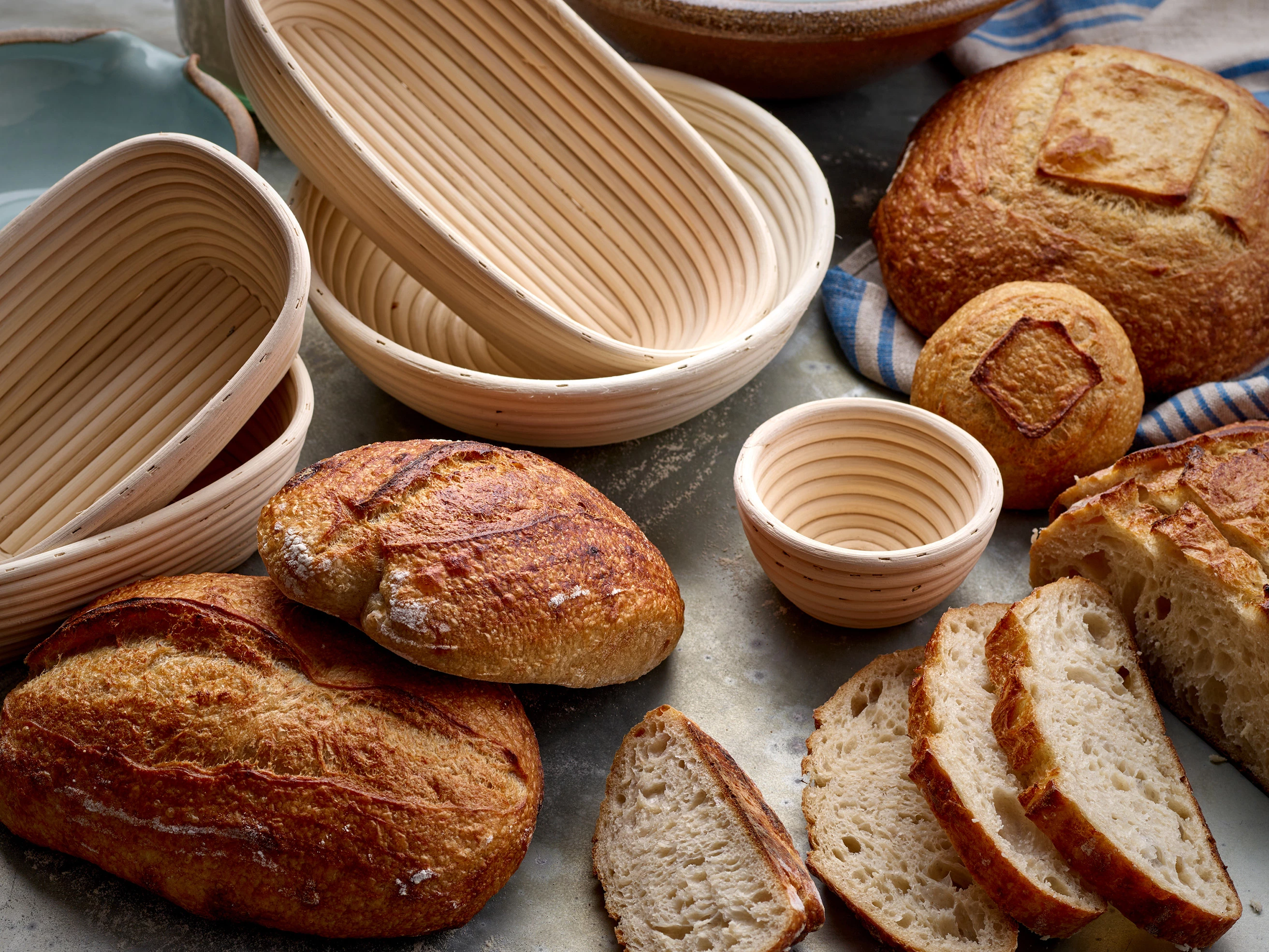 proofing baskets arranged with crusty loaves